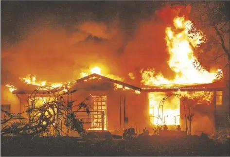  ?? AP PHOTO/ETHAN SWOPE ?? A house burns on Platina Road at the Zogg Fire near Ono, Calif., on Sept. 27, 2020.
