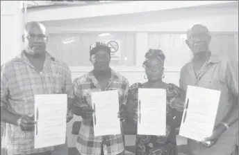  ??  ?? Rice farmers (from left) Rawle Miller, Rupert Blackman, Doreen Monah and Philip Alexander Johnson holding up their leases.