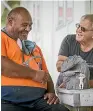  ??  ?? Rangima¯ rie Maori Arts and Crafts Centre chairman Barry Te Whatu, with New Plymouth Surfriders Club secretary Allen Pidwell, with a trophy carved for the Easter Masters surfing competitio­n in 2018.