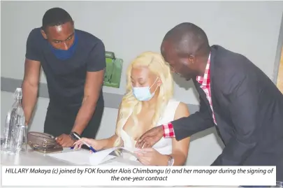  ??  ?? HILLARY Makaya (c) joined by FOK founder Alois Chimbangu (r) and her manager during the signing of the one-year contract