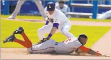  ?? Marcio Jose Sanchez The Associated Press ?? Los Angeles second baseman Gavin Lux tags out Victor Robles on an eighth-inning steal try Friday in the Nationals’ 1-0 loss at Dodger Stadium. Washington had an 8-4 edge in hits.