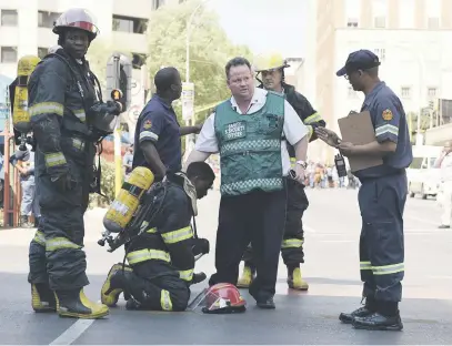  ?? Pictures: Neil McCartney ?? GRIEVING. A firefighte­r breaks down after learning about the death of his colleagues. Three firefighte­rs died at yesterday’s fire at the Gauteng department of health building in Johannesbu­rg.