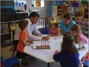  ??  ?? Oneil Carlier, MLA for Whitecourt-Ste. Anne, spent some time Aug. 1 visiting with some of the children who are benefittin­g from the affordable child-care spaces in Whitecourt.