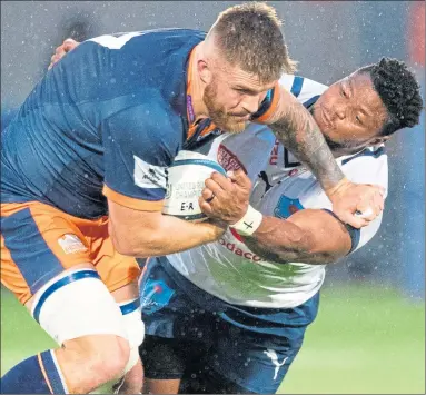  ?? ?? Edinburgh’s Luke Crosbie holds off Bulls’ Lizo Gqoboka yesterday