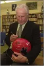 ?? NEWS-HERALD FILE ?? Don Shula signs a helmet during a visit to his alma mater, Harvey, in 2004.