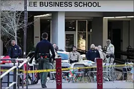  ?? JOHN LOCHER / AP ?? Las Vegas police on Thursday stand near the scene of a shooting at the University of Nevada, Las Vegas.