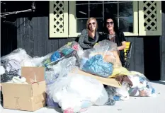  ?? LAURA BARTON/POSTMEDIA NEWS ?? Business director Krystal Raimondo and vice-president Lynn Melloni of Welland business Urge to Purge sit out front of the company building with a load of items that are going to be donated to local charities.