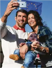  ?? Jim Watson / Getty Images ?? Olympic swimmer Michael Phelps and Nicole Johnson tied the knot. They have a son, Boomer.