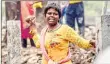  ??  ?? A slum dweller pelts stone at the police during a demolition drive of illegal slums on a CIDCO plot, in Navi Mumbai on Tuesday.
