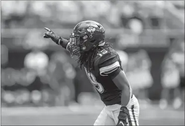  ?? TYLER TATE/AP PHOTO ?? UConn defensive back Durante Jones signals to the sideline during the Huskies’ 2022 season opener against Utah State in Logan, Utah.