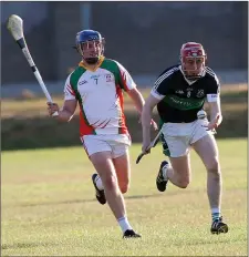  ??  ?? Cian O’Byrne of Bray Emmets is tracked by Kiltegan’s Eoghan Higgins.