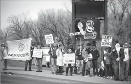  ?? Herald photo by Tijana Martin ?? Members of the community gathered on the corner of University Drive West and Columbia Boulevard West on Saturday for the Lethbridge Solidarity Gathering for the March for Science. @TMartinHer­ald