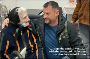  ?? ?? Caring side: Pini Schwarzman with the 94-year-old Holocaust survivor he met in Ukraine