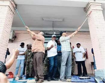  ?? FILE ?? Could Prime Minister Andrew Holness (right), Opposition Leader Dr Peter Phillips (left) and Police Commission­er George Quallo tackle crime together as they did the facelift for the Kingston Central Police Station on Labour Day in May?