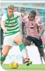  ??  ?? Reginald Mbu Alidor up against Celtic’s Kris Ajer