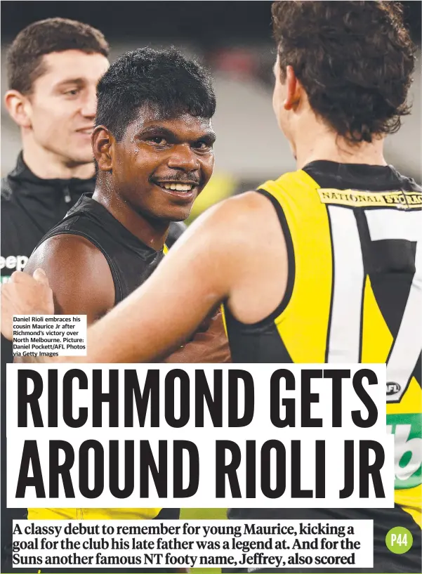  ?? Picture: Daniel Pockett/AFL Photos via Getty Images ?? Daniel Rioli embraces his cousin Maurice Jr after Richmond’s victory over North Melbourne.