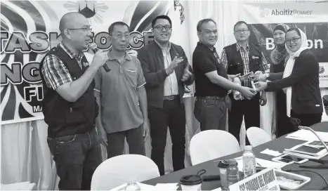  ??  ?? CEREMONIAL TURNOVER. In photo (from left to right) are USec. Falconi V. Millar, secretary general of HUDCC; Ramon Carlos O. Florese, NEA acting director; Christophe­r M. Camba, VP for Government Relations of Aboitiz Equity Ventures; Mark A. Valencia,...