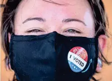  ??  ?? Ashlee King votes at the El Tianguis Mercado polling place in Guadalupe on Tuesday. MARK HENLE/THE REPUBLIC