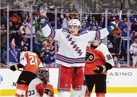  ?? Derik Hamilton/Associated Press ?? New York Rangers’ Matt Rempe fought seconds into his first NHL shift. Rangers fans chant his name whether he is playing or not. The 6-foot-8 forward was a central figure in a rare line brawl. And at 21 he has become a modern-day cult hockey hero.