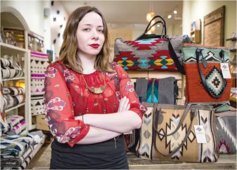  ?? | JAMES FOSTER/ FOR THE SUN- TIMES ?? Allison Geitner, manager of Greenheart Shop in Old Town, says prices on handbags and other goods imported from Mexico would likely go up even more than the 20 percent tax that President Donald Trump is proposing.