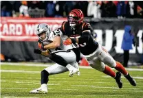  ?? AP ?? Linebacker Logan Wilson injured his shoulder in a Week 13 loss to the Chargers and was carted off the field, but he returned four weeks later to help the Bengals clinch the AFC North title.