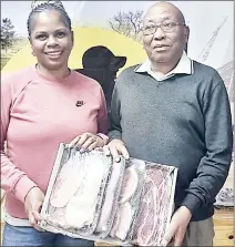  ?? (Courtesy pic) ?? Golfer Mafukuzela Nojekwa (R), who has won the Mkotoka Leg of Lamb twice within a space of three weeks, receiving his prize from Mbabane Golf Club Captain Fisiwe Vilane.