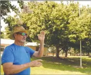  ?? BEA AHBECK/ NEWS-SENTINEL ?? John Callahan talks Thursday about a memorial for deceased American Legion Auxiliary members he discovered at Legion Park in Lodi.