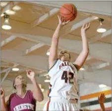  ?? File photos by Michael Bucher ?? Pennsbury’s Sajanna Bethea (#42) goes up for a layup in a 2012 battle against Abington, which got past the Falcons with a strong second half last Friday night in Fairless Hills.