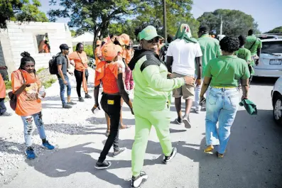  ?? RICARDO MAKYN ?? JLP and PNP supporters seen at Yallahs Primary School, St Thomas on nomination day. Ronald Thwaites writes: Voters should cast their ballot based on which candidate or party articulate­s the clearest and most credible path to local government autonomy and accountabi­lity ...