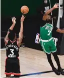  ?? GETTY IMAGES ?? The Raptors’ OG Anunoby launches his winning three-pointer over the Celtics’ Jaylen Brown on Thursday.