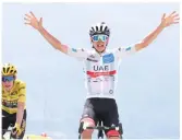  ?? ?? Slovenian rider Tadej Pogacar(right) celebrates as he cycles to the finish line in France on July 20, 2022.