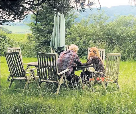  ??  ?? A photograph, the origin of which is unknown, emerged yesterday showing Boris Johnson and Carrie Symonds apparently romantical­ly reconciled after their much-publicised row