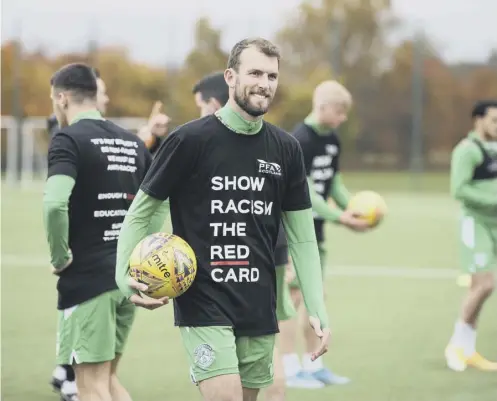  ??  ?? 0 Hibs striker Christian Doidge shows his support for Show Racism the Red Card