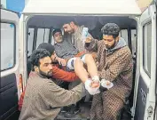  ??  ?? Locals carrying an injured student to a hospital in Srinagar on■Wednesday. WASEEM ANDRABI/HT