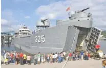  ?? STAFF FILE PHOTO ?? People waiting in line to board the USS LST-325 on a previous visit to Chattanoog­a. The World War II landing ship is docked at Ross’s Landing through Tuesday, Aug. 27.