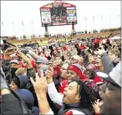  ?? MICHAEL NOBLE JR. / AP ?? Western Kentucky players and fans celebrate a second straight Conference USA championsh­ip after last week’s 58-44 victory over Louisiana Tech.