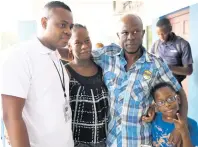  ?? RICARDO MAKYN/CHIEF PHOTO EDITOR ?? From left: Detective Constable Morvin Ellis; mother Suzett Whyte with dad Sinclair Hutton and brother Rudean at the Denham Town Police Station yesterday after news broke that the stolen baby from the Victoria Jubilee hospital had been found.