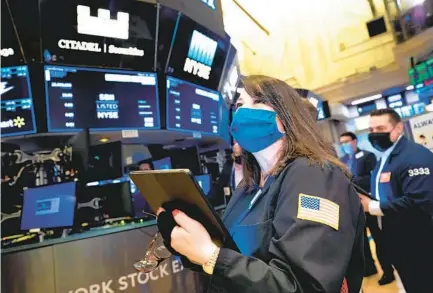  ?? NICOLE PEREIRA AP ?? A year ago, a free fall for the stock market wiped out three years’ worth of gains. The market recovered all its losses by August, ushering in one of its greatest runs. The S&P 500 has surged 76.1 percent in a year.