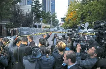  ?? Emrah Gurel/Associated Press photos ?? Members of the media gather Monday on the blocked road leading to Saudi Arabia’s Consulate in Istanbul.