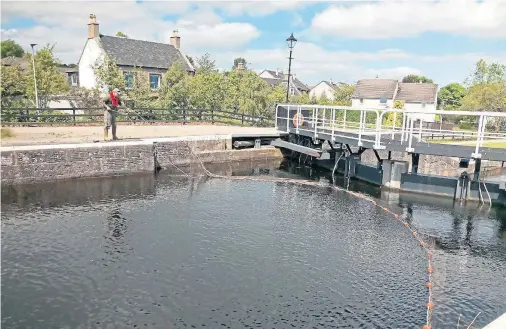  ??  ?? RESCUE: The Caledonian Canal at Muirtown Basin, Inverness, where a concerted effort is under way to free the stricken young salmon