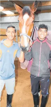  ??  ?? Jockey brothers Ashvin and Jeetesh Mudhoo with Levin horse Jane O’.
