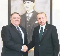  ??  ?? A handout picture taken and released by the Turkish Presidenti­al Press Office shows Erdogan (right) and Pompeo shaking hands as they pose for a photo during their meeting at Esenboga Internatio­nal Airport in Ankara.