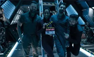  ??  ?? Above, right: Wes Chatham, Dominique Tipper, Steven Strait and Cas Anvar on set