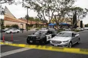  ?? JAE C. HONG / AP ?? An Orange County sheriff’s vehicle is parked at Geneva Presbyteri­an Church in Laguna Woods, California, on Monday where a man opened fire Sunday.