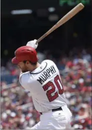  ?? NICK WASS — ASSOCIATED PRESS ?? Washington Nationals’ Daniel Murphy follows through on a single that scored two runs during the sixth inning of a baseball game against the New York Mets, Tuesday, July 4, 2017, in Washington. The Nationals won 11-4.
