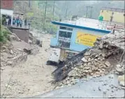  ??  ?? Two-three rooms of a school building were washed away. However, there were no students at the time of the incident. HT PHOTO