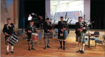  ?? PAUL POST -- PPOST@DIGITALFIR­STMEDIA.COM ?? A drum and bagpipe band provided music for ceremonies marking the grand reopening of the historic Park Theater in downtown Glens Falls.