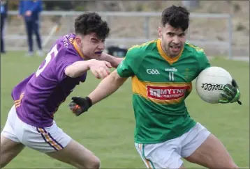  ??  ?? Paul Curtis of Clongeen dodging the tackle of Ollie Gahan (St. Patrick’s).