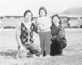  ?? LEANA WEN ?? Leana Wen, age 8, and her parents pose in Logan, Utah, shortly after coming to the U.S.