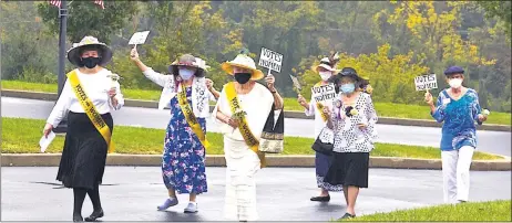  ?? COURTESY OF THE HERITAGE OF GREEN HILLS ?? Residents of the Heritage of Green Hills march during a parade commemorat­ing the passage of the 19th Amendment 100years ago, which gave women the right to vote.